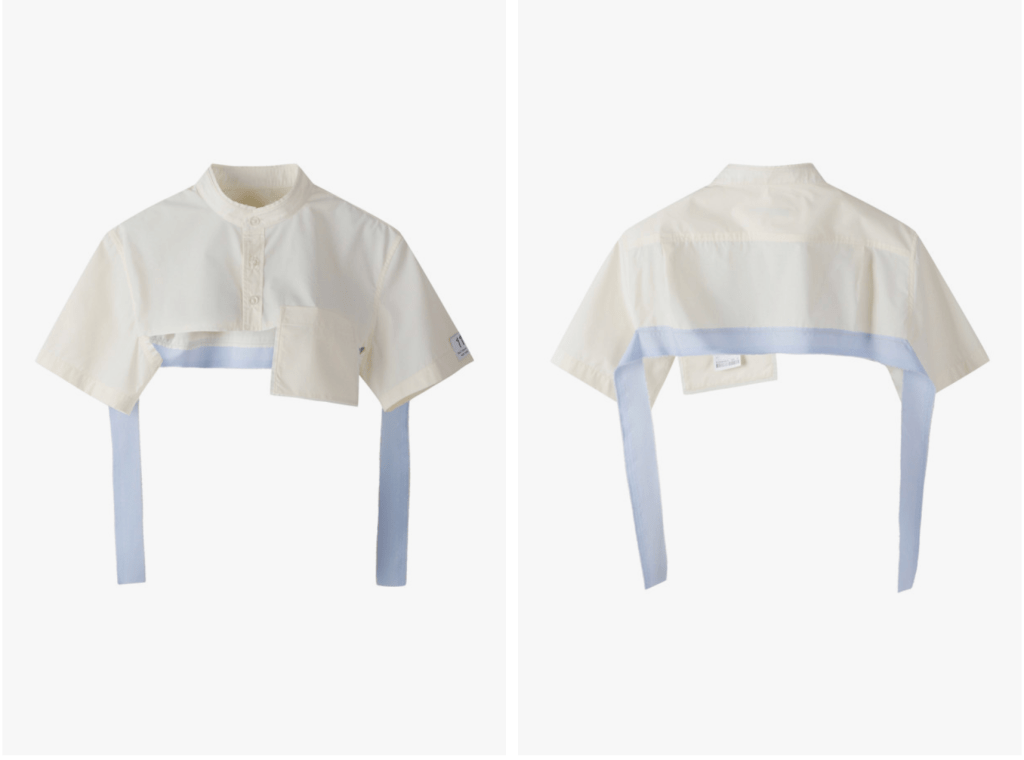 An upcycled cropped button-up shirt with a collared neckline, featuring a light blue ribbon and a front pocket, showcasing a modern Korean-inspired design.