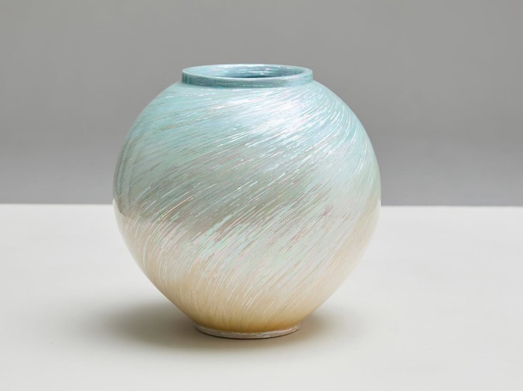 A beautifully crafted jagae vase featuring a swirl pattern with shades of light blue and iridescent finishes, highlighting its mother-of-pearl inlay craftsmanship.